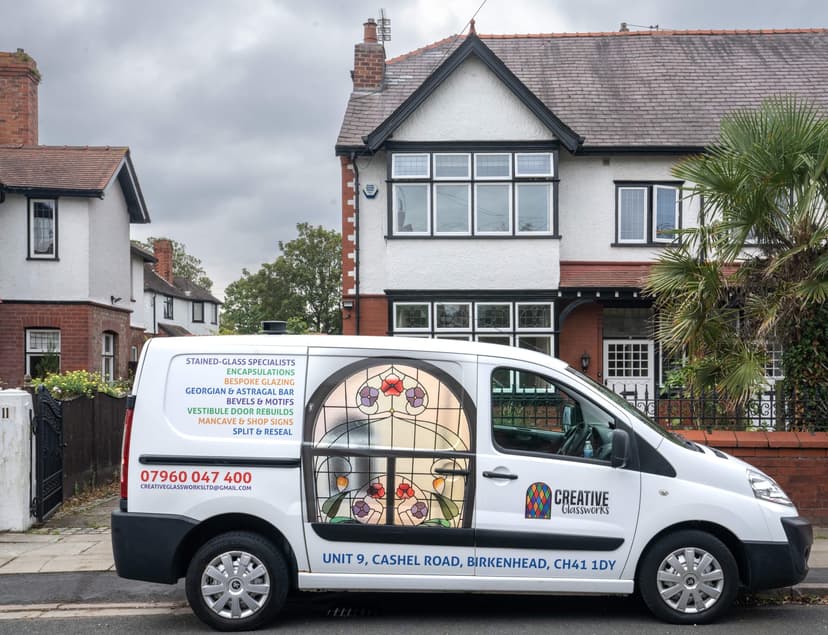 The Creative Glassworks van outside a customer's home